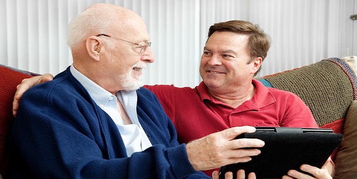 man talking with elderly dad about finances