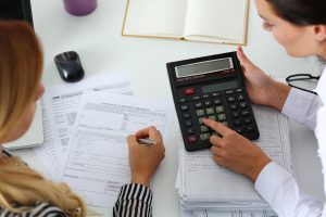 two female accountants working on employee benefit plan