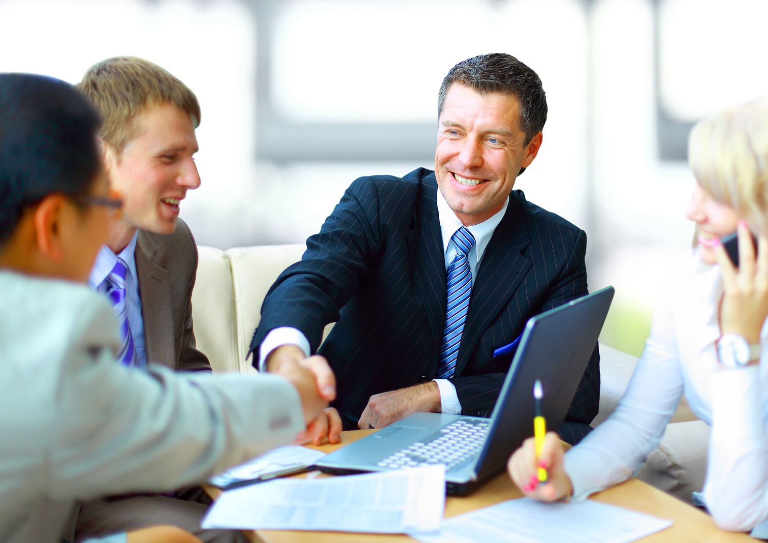 men shaking hands in business meeting | mergers and acquisitions