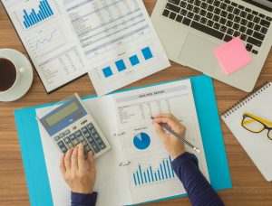 person's hands working on Illinois taxes