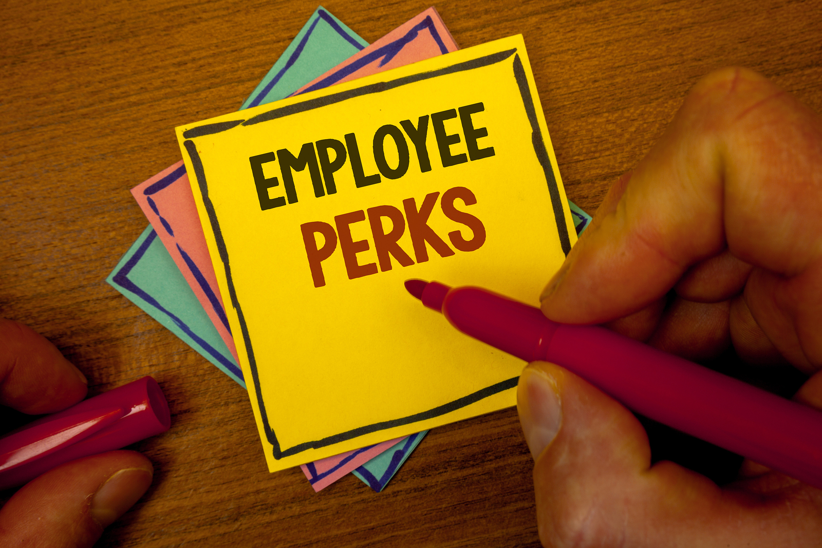 hand writing on employee perks post it | benefits package
