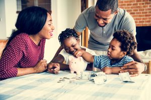 parents showing their children how to be financially savvy