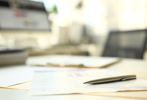 a desk used by an accountant performing payroll services